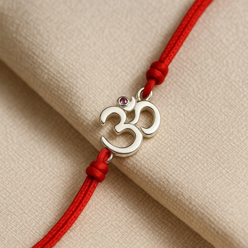 Zarkan OM With Ruby Stone Silver Rakhi With Roli Chawal