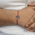 Zarkan OM With Ruby Stone Silver Rakhi With Roli Chawal