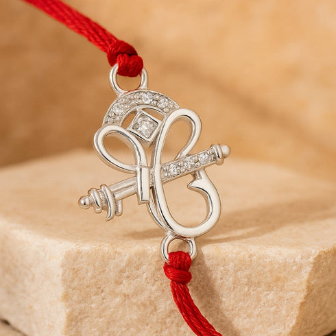 Zarkan Lord Ganesha Precious Silver Rakhi With Roli Chawal
